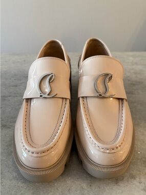 Christian Louboutin CL Moc Lug patent leather loafers.